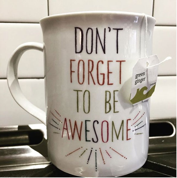 white cup with quote of "Don't Forget To Be Awesome"